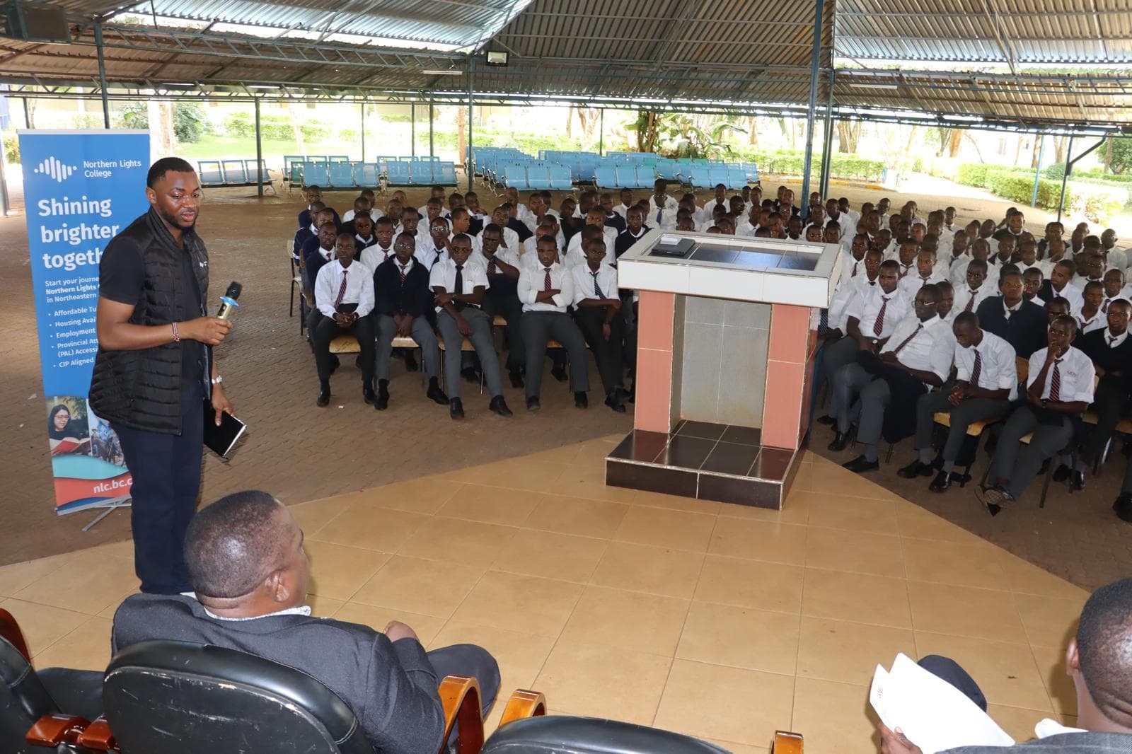 Elimu advisor helping a student with an application