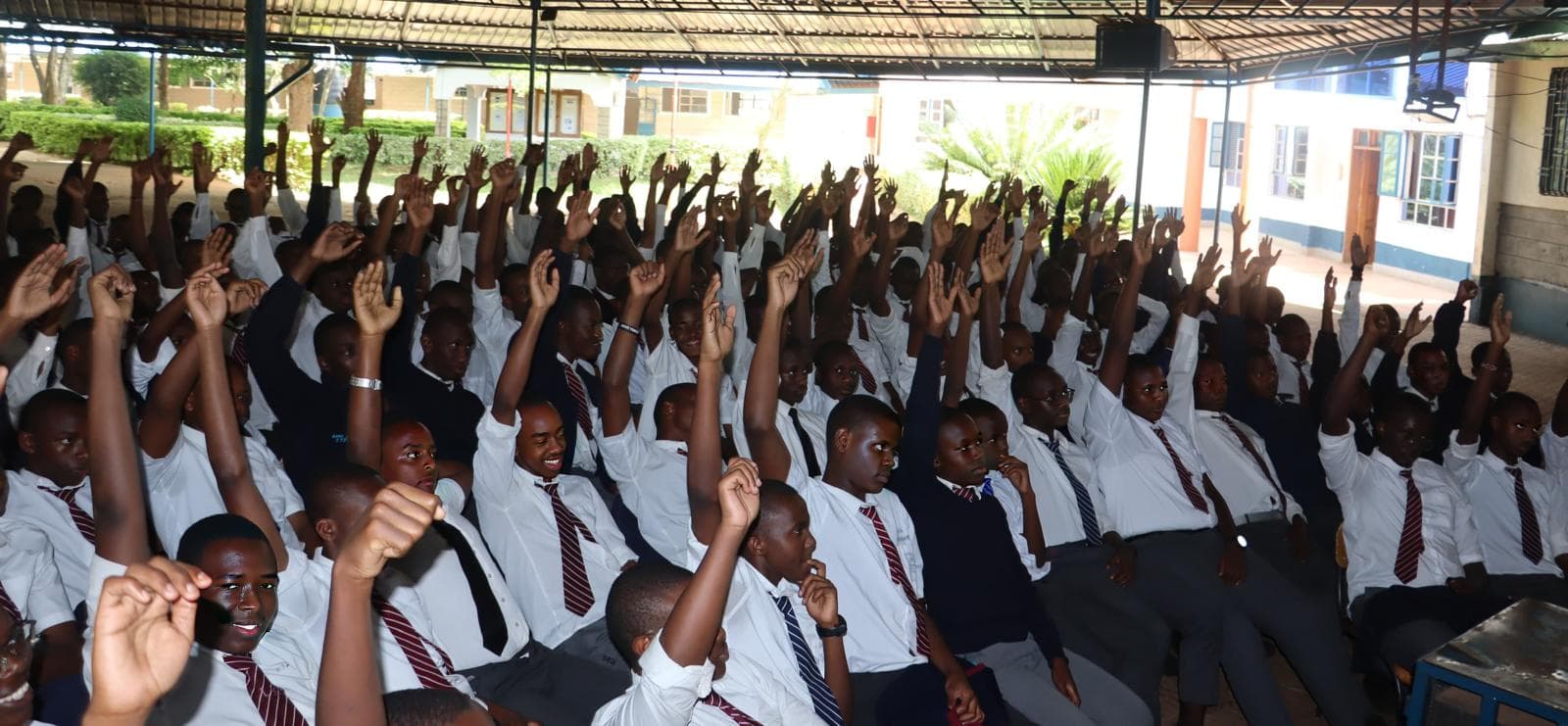 Kenyan secondary school students responding enthusiastically to an Elimu presentation